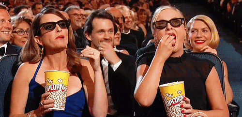 Tina Fey Amy Poehler pop corn at Emmys