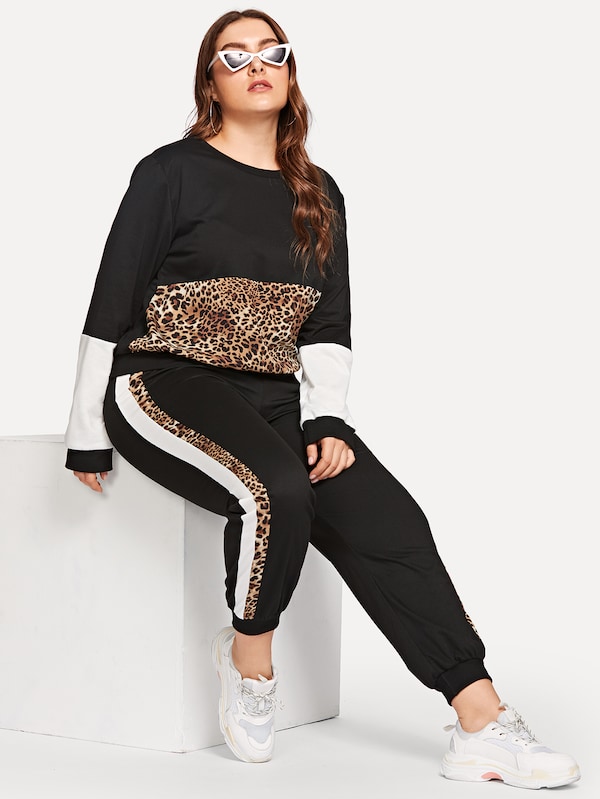 SHEIN Conjunto pullover panel de leopardo con pantalones